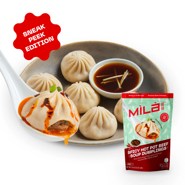Close-up of Spicy Hot Pot Beef soup dumplings with one dumpling oozing spicy broth, dipping sauce, pack, and Sneak Peek badge