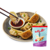 Front view of MìLà chicken potstickers showing pan-fried golden bottoms, green onion, dipping sauce, and product bag